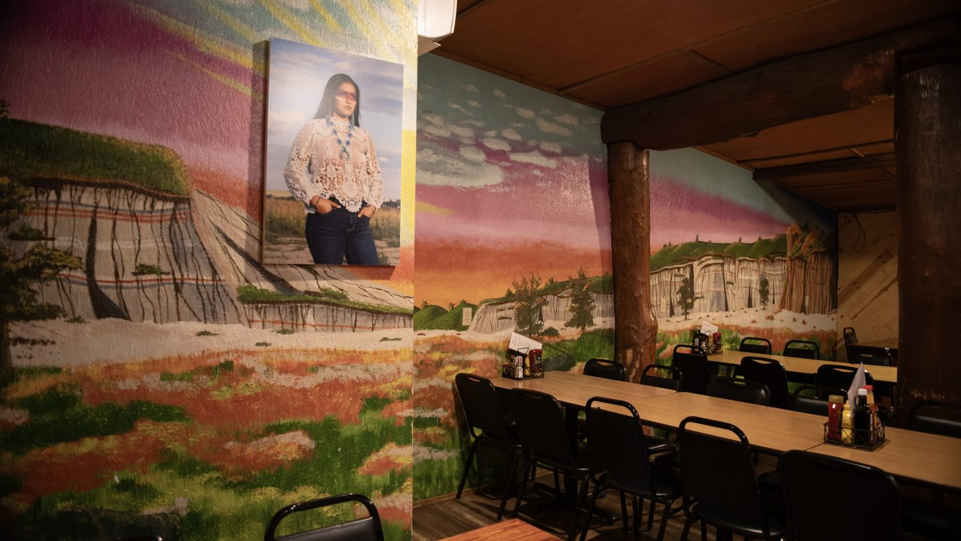 The hand-painted Badlands mural in the back room at Burly's Roughrider